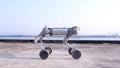 A close-up of the Unitree B2 W joint motor and leg reinforcement structure highlights its high rigidity design.