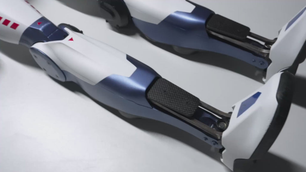 This promotional video showcases the advanced full-body dynamics control capabilities of the Unitree R1 general-purpose humanoid robot. The video demonstrates the R1's robust walking on complex unstructured terrain (such as slopes and uneven ground), dynamic balance control when climbing stairs, and its flexibility in omnidirectional movement within confined spaces, highlighting its high degree of freedom of motion potential.