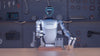 Unitree G1 humanoid robot performing dynamic stability tests indoors: trotting, quick turns, small jumps, and rapid sit-to-stand transitions. About 1.32 m tall, 35 kg, with 23–43 joint motors.